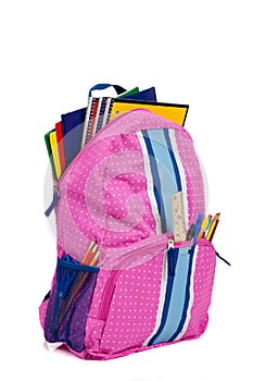 Pink backpack with school supplies