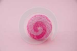 Pink ball from garland made of cotton threads or yarn