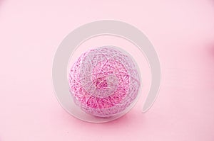 Pink ball from garland made of cotton threads or yarn