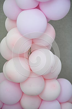 Pink balloons decorated wall as background. Beautiful background with colorful balloons