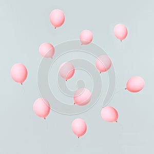 Pink balloons on light blue sky