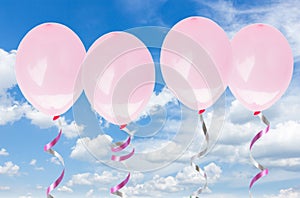 Pink baloons in the sky