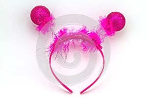 Pink band on the head with ball feather isolated on a white back