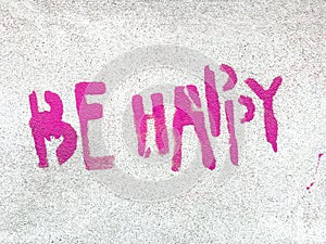 Pink Be happy written in graffiti style