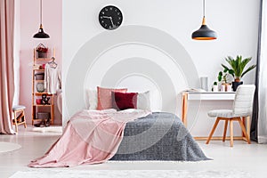 Pink bedroom interior with chair