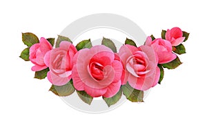 Pink begonia flowers in a floral arrangement isolated