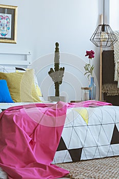 Pink blanket on king-size bed