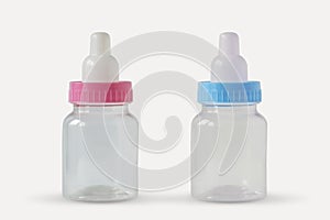 Pink and blue baby bottles - Male or female? Concept of future baby gender