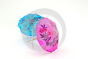 Pink and blue cocktail umbrellas