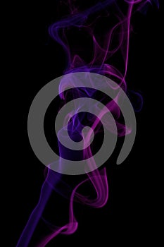 Pink and blue colored smoke pattern on black