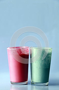 Pink and blue flavored milkshakes