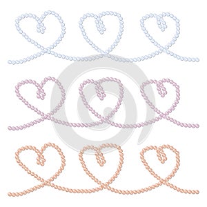 Pink, blue and lavender strings of pearls in a heart shape