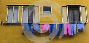 Pink and blue pyjamas drying on a clothes line