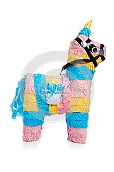 Pink, blue and yellow burro pinata on white