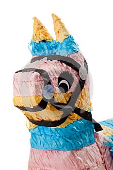 Pink, blue and yellow burro pinata on white