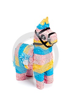 Pink, blue and yellow burro pinata on white