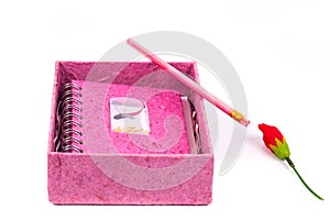 pink book note and paper box