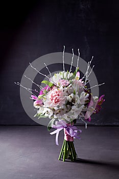 Pink bouquet from gillyflowers and alstroemeria on blackboard