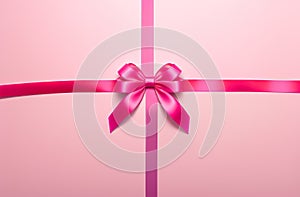 Pink bow on a gift close-up, wallpaper background