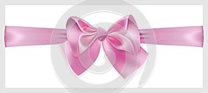 Pink bow with ribbon, located horizontally