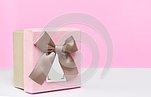 Pink box on the table, festive background