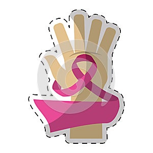Pink breast cancer ribbon in the hand