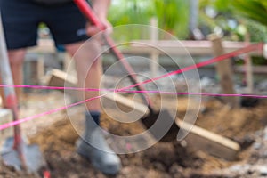 Pink builders string-line closeup on constructions site in selective focus