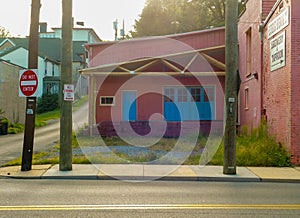 A Pink Building With Blue Doors