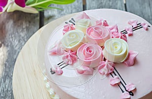 Pink cake on the wooden table