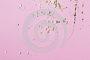 Pink cardboard with gold potal drops and splashes. Creative background, copy space photo