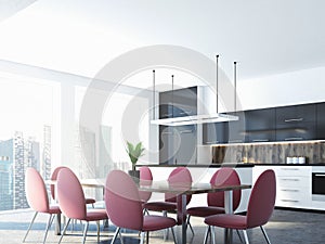 Pink chairs and dining room table, kitchen corner