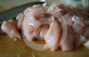 Pink chicken meat cut in dice the food product macro