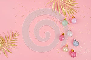 Pink Christmas background with balloons and golden branch with copy space