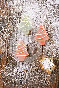Pink christmas tree homemade sweets in rustic style on wooden d