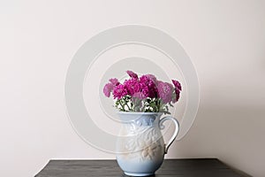 Pink chrysanthemum in a clay rarity vase