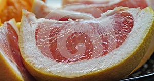 Pink citrus fruit cuts. fresh pink grapefruit fruits slices. Closeup. Selective soft focus. Fruits background. concept