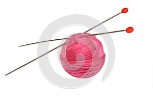 Pink clew and knitting needles isolated on white