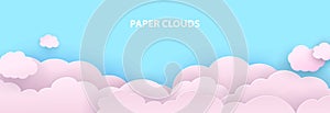 Pink clouds cut out of paper against a blue sky. Template for your design. Vector