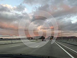 Pink Clouds over a Highway Bridge