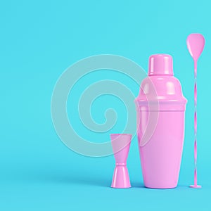 Pink cocktail shaker with jigger and mix spoon on bright blue background in pastel colors