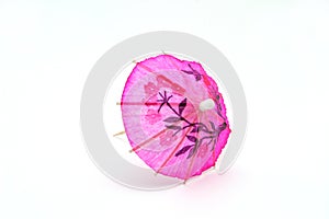 Pink cocktail umbrella, front view