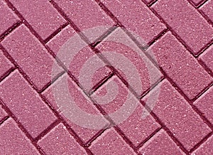 Pink color cobblestone pavement close-up