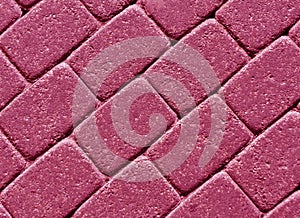 Pink color cobblestone pavement surface.