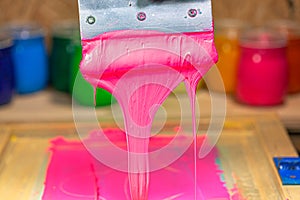 pink color dripping from hand screen printing