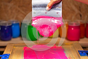 Pink color dripping from hand screen printing