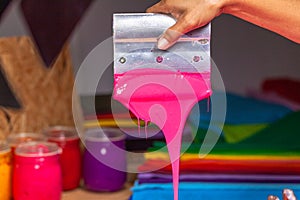 Pink color dripping from hand screen printing