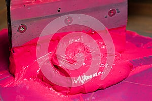 pink color dripping from hand screen printing