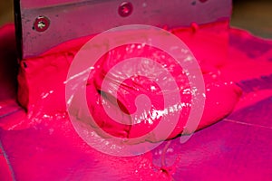 Pink color dripping from hand screen printing