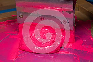 pink color dripping from hand screen printing