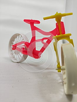 pink color toy bike on white background isolate